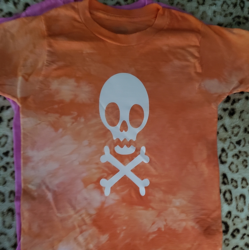 Orange scrunch tie dyed. Skull and cross bones. Glow in the dark